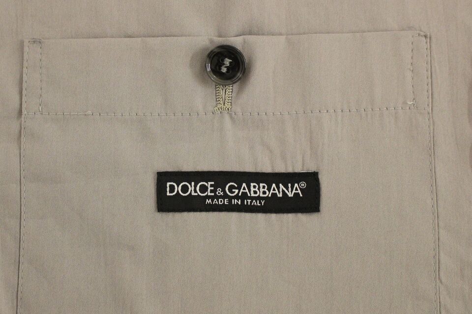 Dolce &amp;amp; Gabbana Grå bomullsklänning med smal passform och knappar framtill