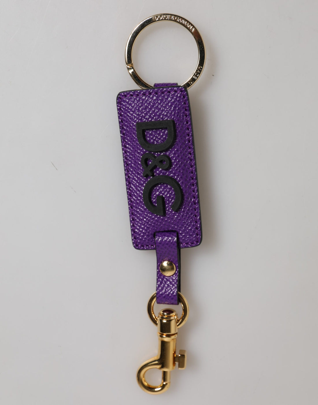 Dolce &amp;amp; Gabbana Lila DG-logotyp Lädernyckelring i guldfärgad metall
